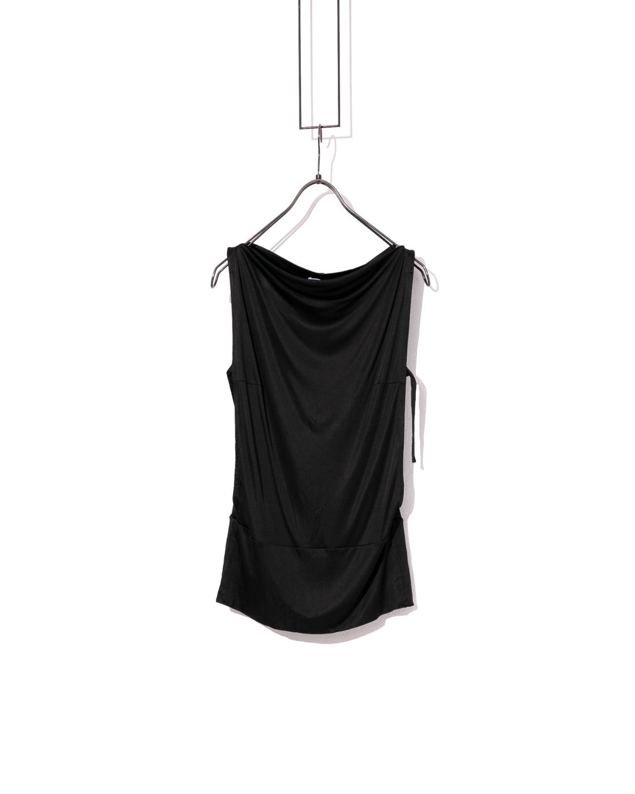 Black sleeveless cotton cut-and-sew women's top hanging on a hanger against a white background.