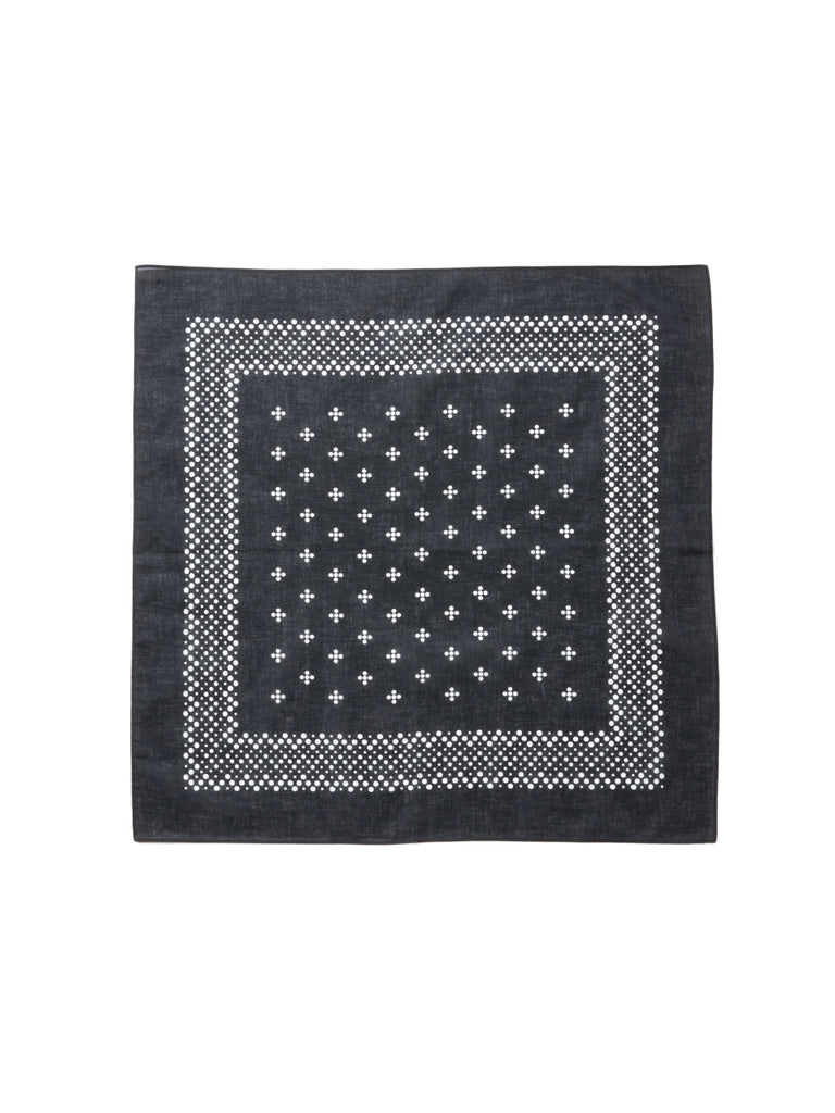 Flat-lay photo of a square cotton bandana with white cross motifs and a dotted border.