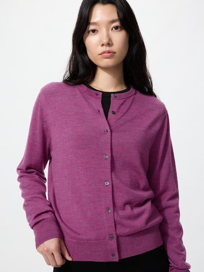 Model wearing a purple cotton-blend V-neck cardigan buttoned down the front.