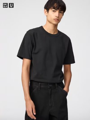 Male model wearing a black crew-neck T-shirt.