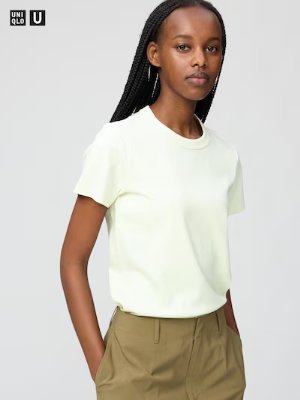 Model wearing a light-colored crew-neck cotton T-shirt with short sleeves.