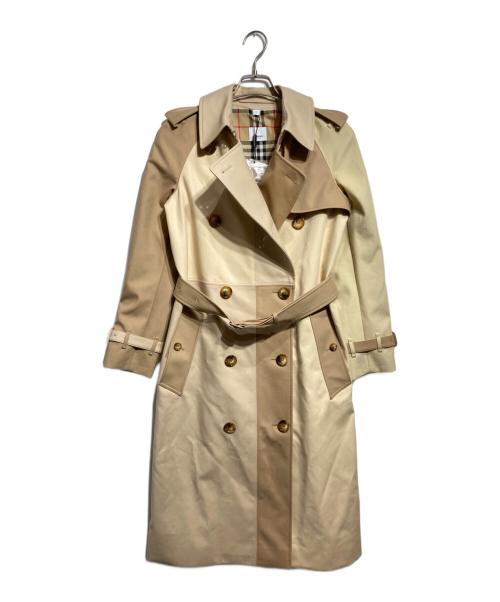 Front view of the women's cotton patchwork trench coat in beige tones hanging on a hanger.