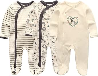 Three cotton newborn long-sleeve footed pajamas laid flat: striped, patterned, and cream with a heart motif.