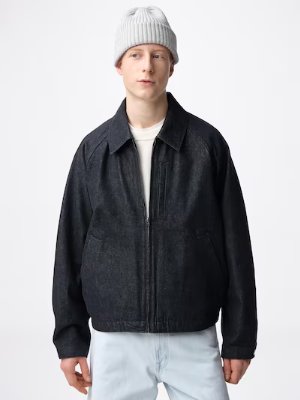 Model wearing a dark cotton zip-up jacket with a collar and front pockets.