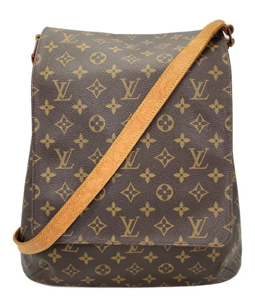 Front view of a brown monogram-pattern cow leather shoulder bag with a single leather shoulder strap.