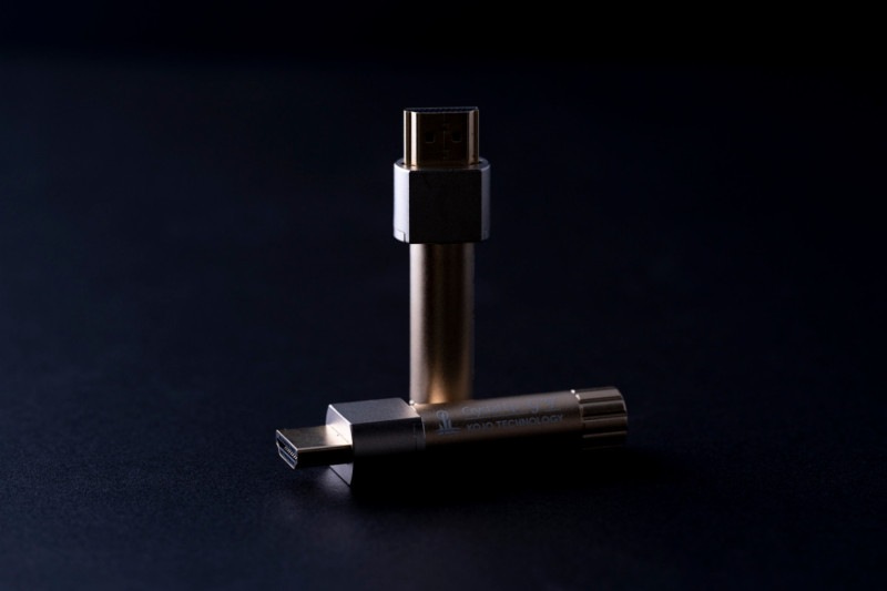 Two metallic Crystal EpHA-G noise reduction accessory units are photographed on a dark background.