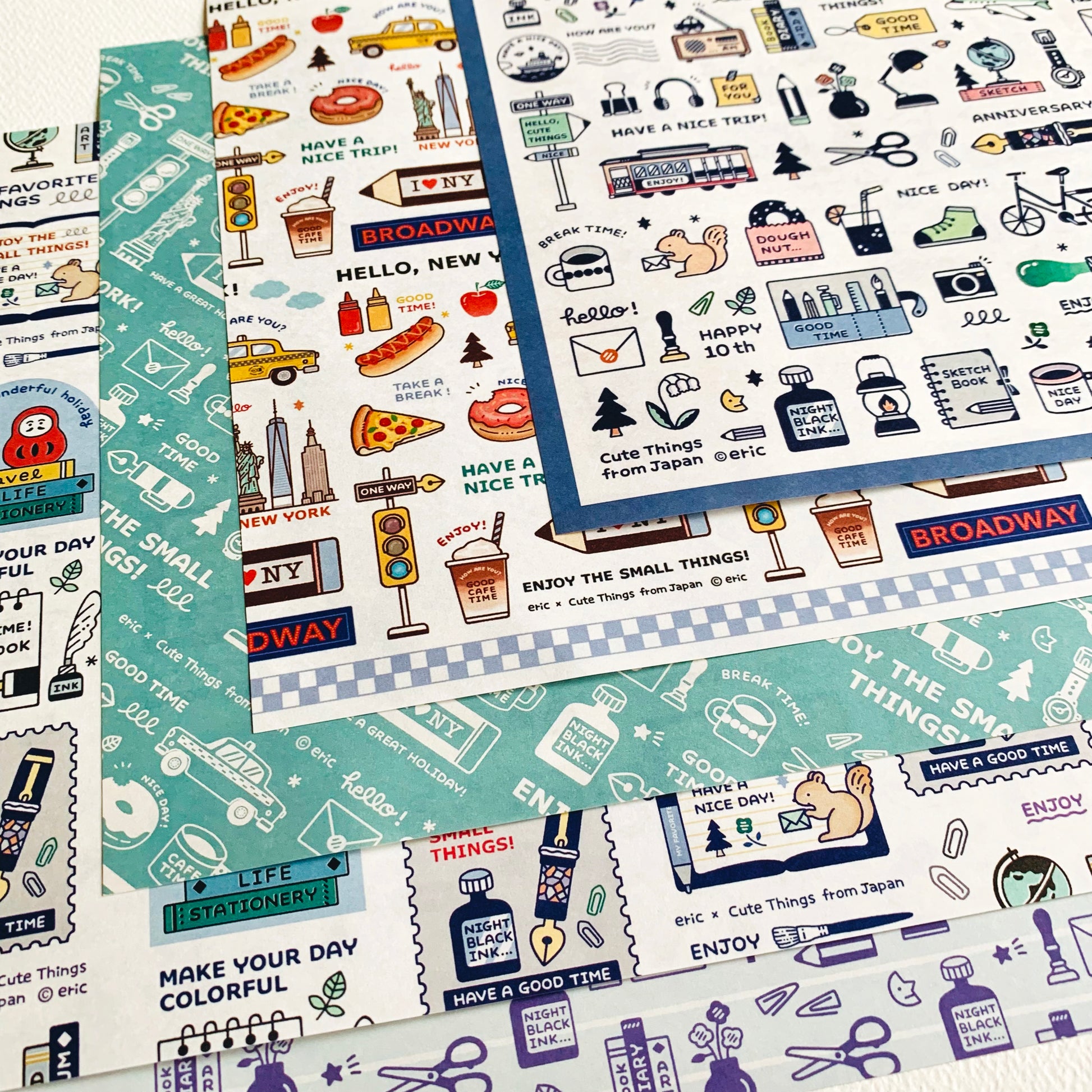 Overlapping sheets showing the CTFJ x eric Memory of New York wrapping paper set with five illustrated New York–themed designs.