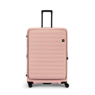 Front view of a large pink plastic suitcase with extended telescoping handle and four spinner wheels.