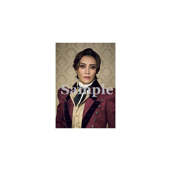 Portrait photograph of a performer in a red and black period costume from the production '赤と黒'.