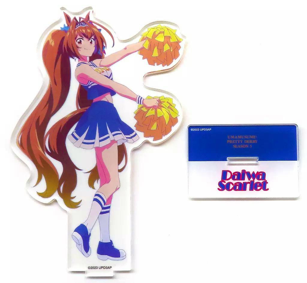 Acrylic stand of Daiwa Scarlet in a cheerleader outfit shown with a separate rectangular base labeled "Daiwa Scarlet".