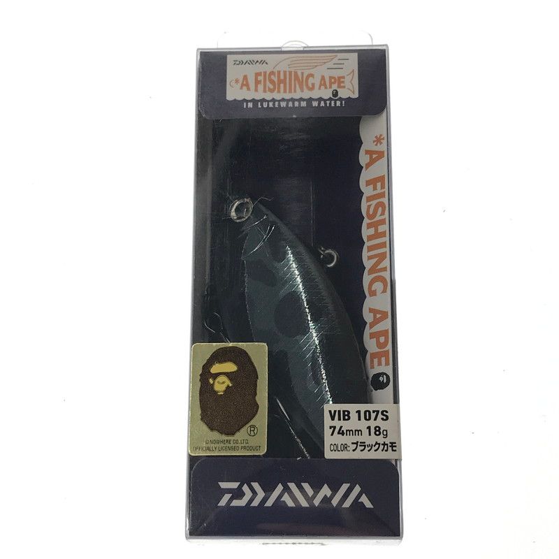 Packaged Daiwa × A BATHING APE VIB 107S fishing lure in its retail box showing branding and label.