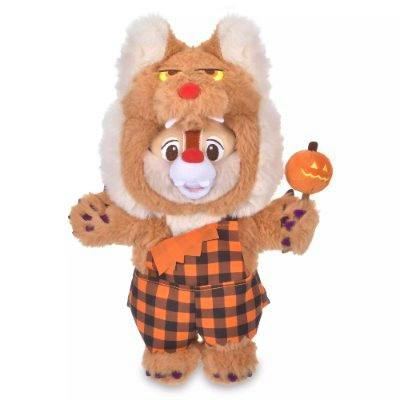 Front view of the Dale Disney Halloween plush hand puppet in a brown furry costume with orange checkered overalls holding a jack-o'-lantern prop.