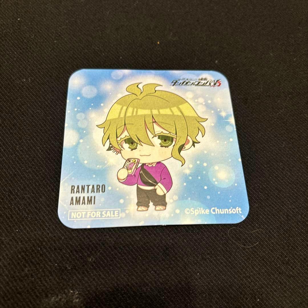 A square coaster for Danganronpa V3 showing a chibi illustration of Rantaro Amami on a blue background with text reading “RANTARO AMAMI” and “NOT FOR SALE.”