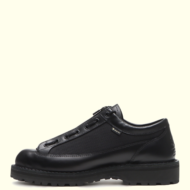 Side profile of a black Danner Field Low R leather shoe on a plain light background.