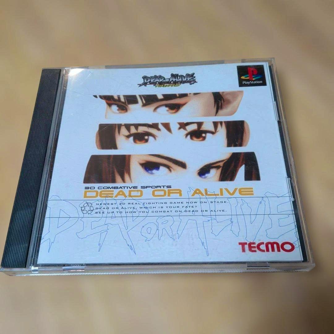Front cover of the DEAD OR ALIVE PlayStation game in its jewel case showing close-up eye artwork and the TECMO logo.