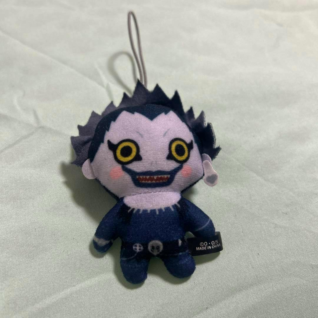 Front view of the DEATH NOTE Ryuk plush mascot showing its face, outfit details, and a hanging loop.