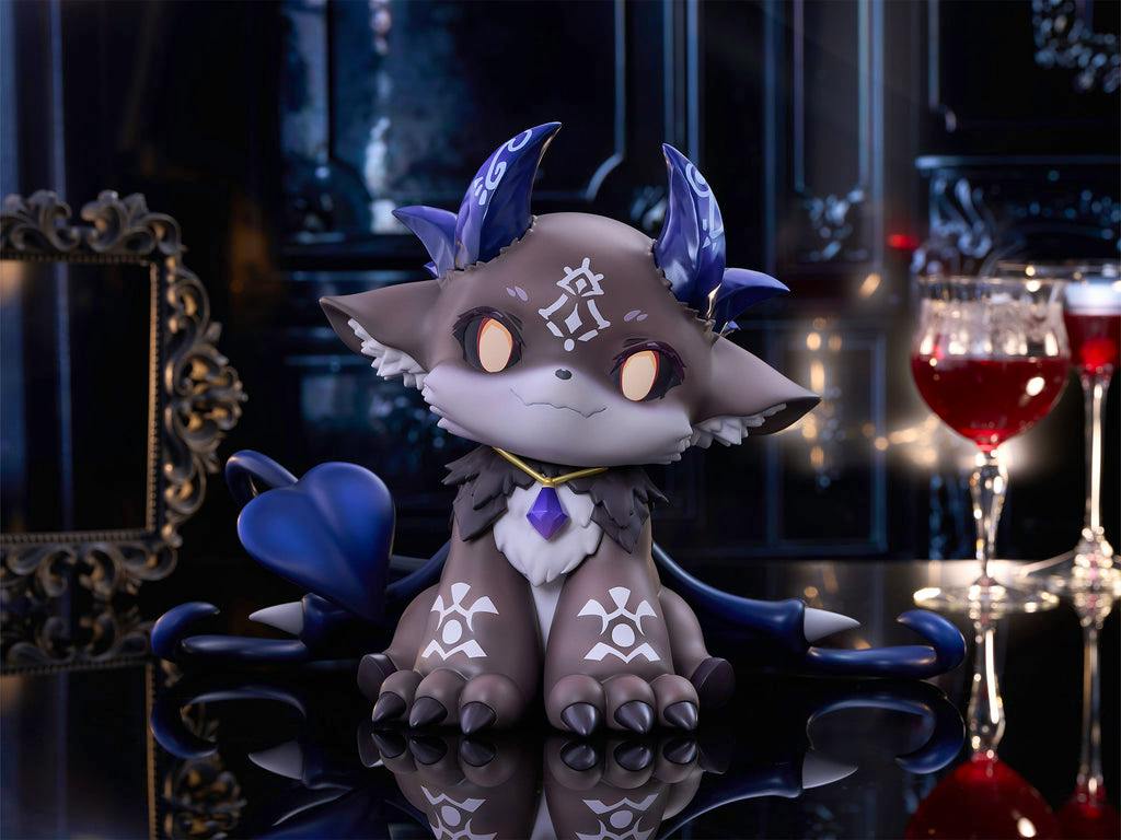 Front view photo of the 1/2-scale soft vinyl figure of でびでび・でびる on a reflective surface with a decorative background.