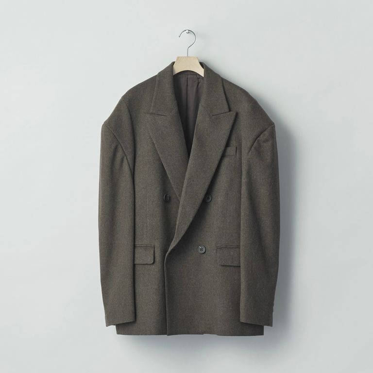 Front view of the men's double-breasted jacket (Loro Piana wool doeskin) hanging on a hanger against a plain light background.