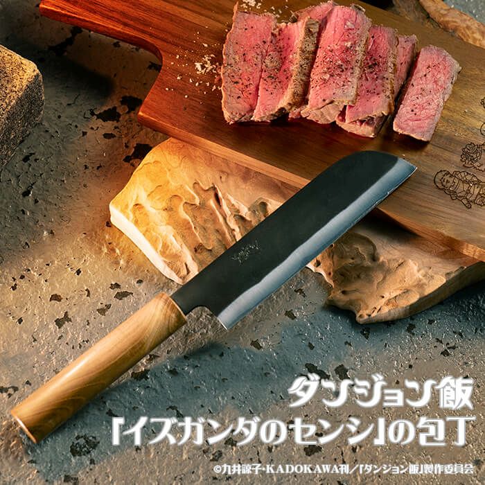 Black-bladed chef knife with a wooden handle displayed on a cutting board beside sliced meat.
