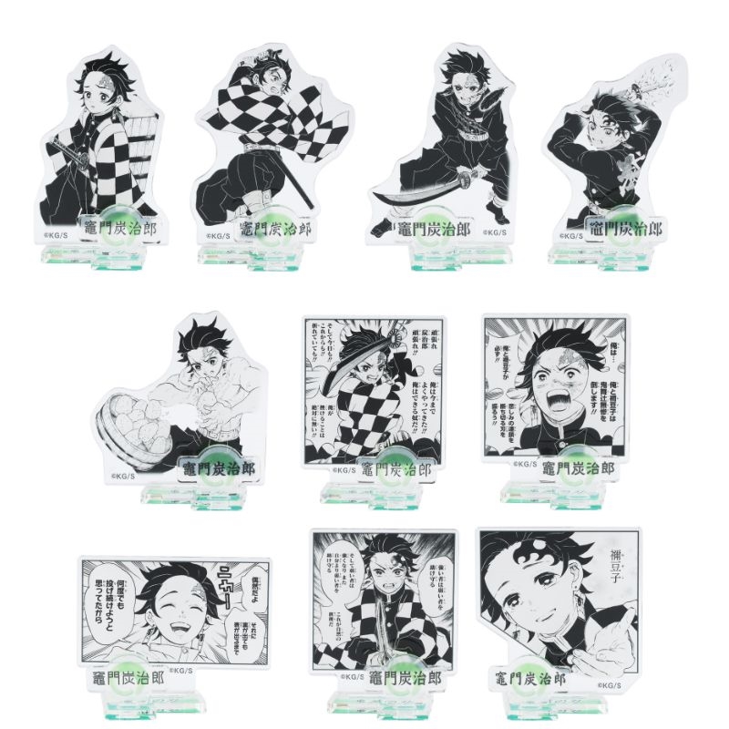 Photo showing multiple black-and-white acrylic figure standees of Tanjiro Kamado from the “HEROES” collection arranged in rows.