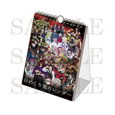 A Demon Slayer (鬼滅の刃) daily desk calendar with spiral binding and a collage of character illustrations on the standing cover.