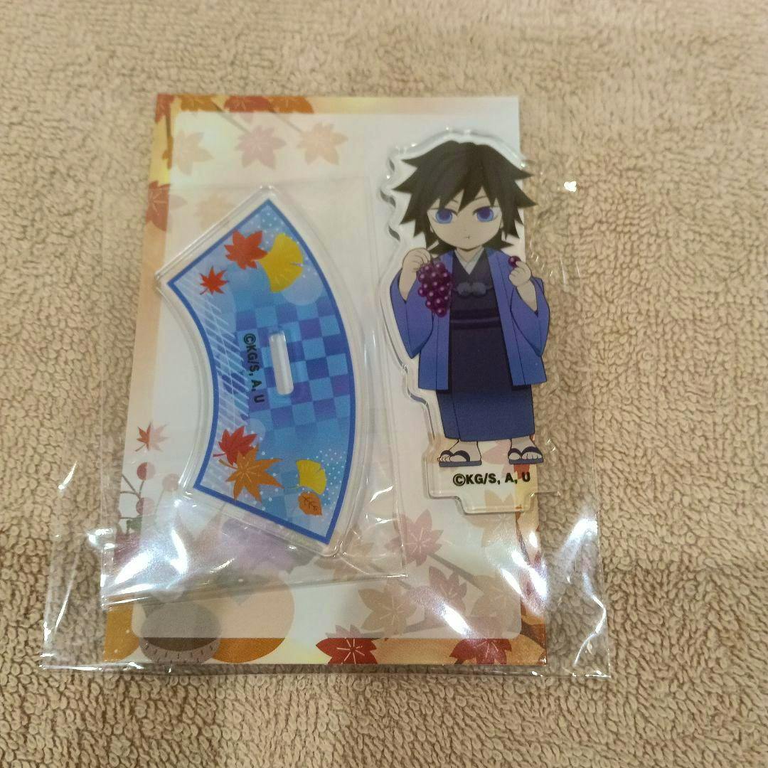 Packaged acrylic decorative stand of 冨岡義勇 (Giyu Tomioka) from Demon Slayer showing the character figure and a blue patterned base on the backing card.