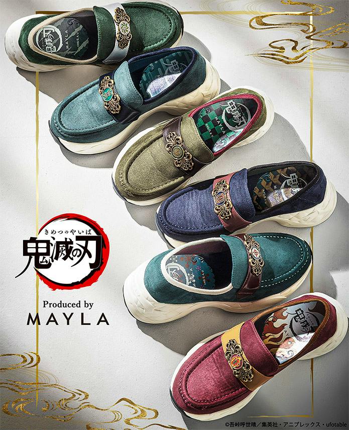 Top-down photo of six loafer-style sneakers in different colors, each with a decorative metal ornament and chunky white soles.