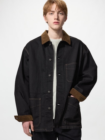 Male model wearing a black denim coverall jacket with a brown collar and front patch pockets.