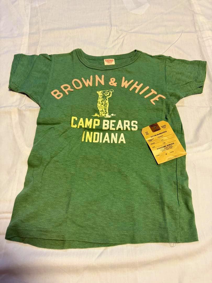 Flat-lay green cotton T-shirt with "BROWN & WHITE CAMP BEARS INDIANA" print and a Denim Dungaree product tag showing size 140.
