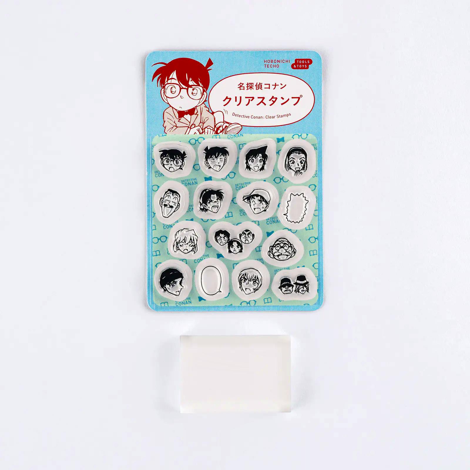 Packaging of Detective Conan clear plastic stamps showing multiple small character-face stamp pieces on a blue backing with the product name at the top.