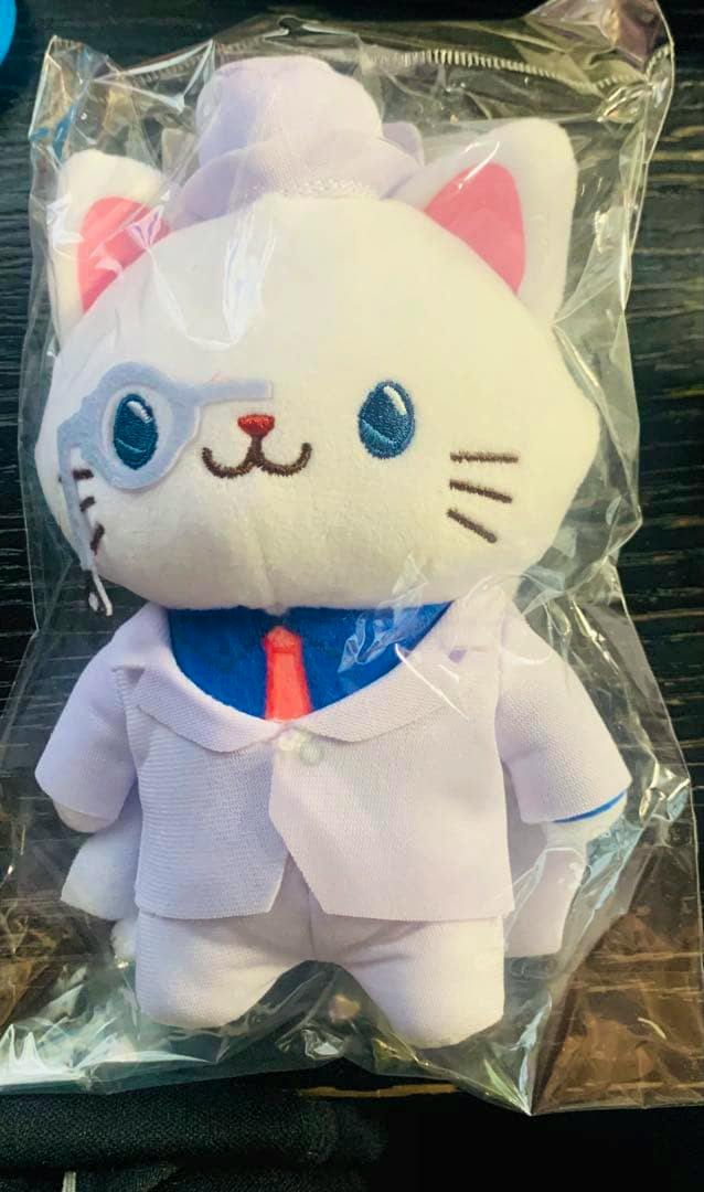 Front view of the Detective Conan Kaitou Kid plush keychain with an eye mask and white suit, shown inside clear plastic packaging.