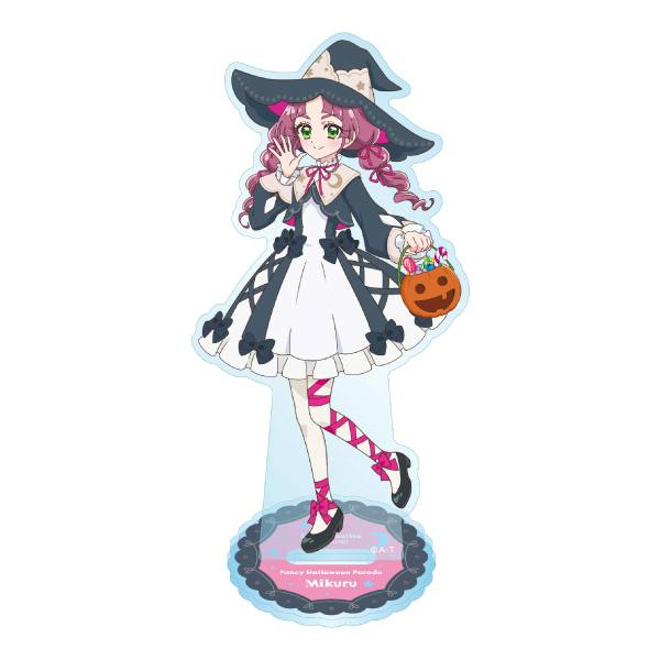 Acrylic stand of Mikuru in a Halloween witch outfit holding a jack-o'-lantern, mounted on its round base.