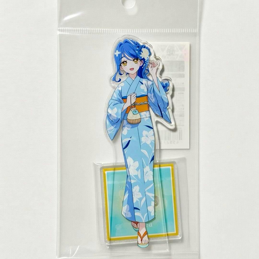 Front view of the 名探偵プリキュア 帆羽くれあ acrylic stand in its packaging, showing the character in a blue yukata and the square display base.