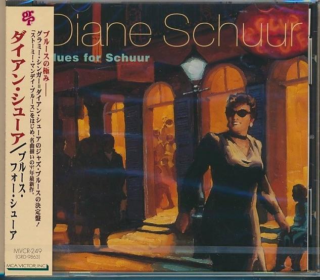 Front cover of the Japanese CD 'Blues for Schuur' (Diane Schuur) showing the illustrated album artwork and an obi strip.