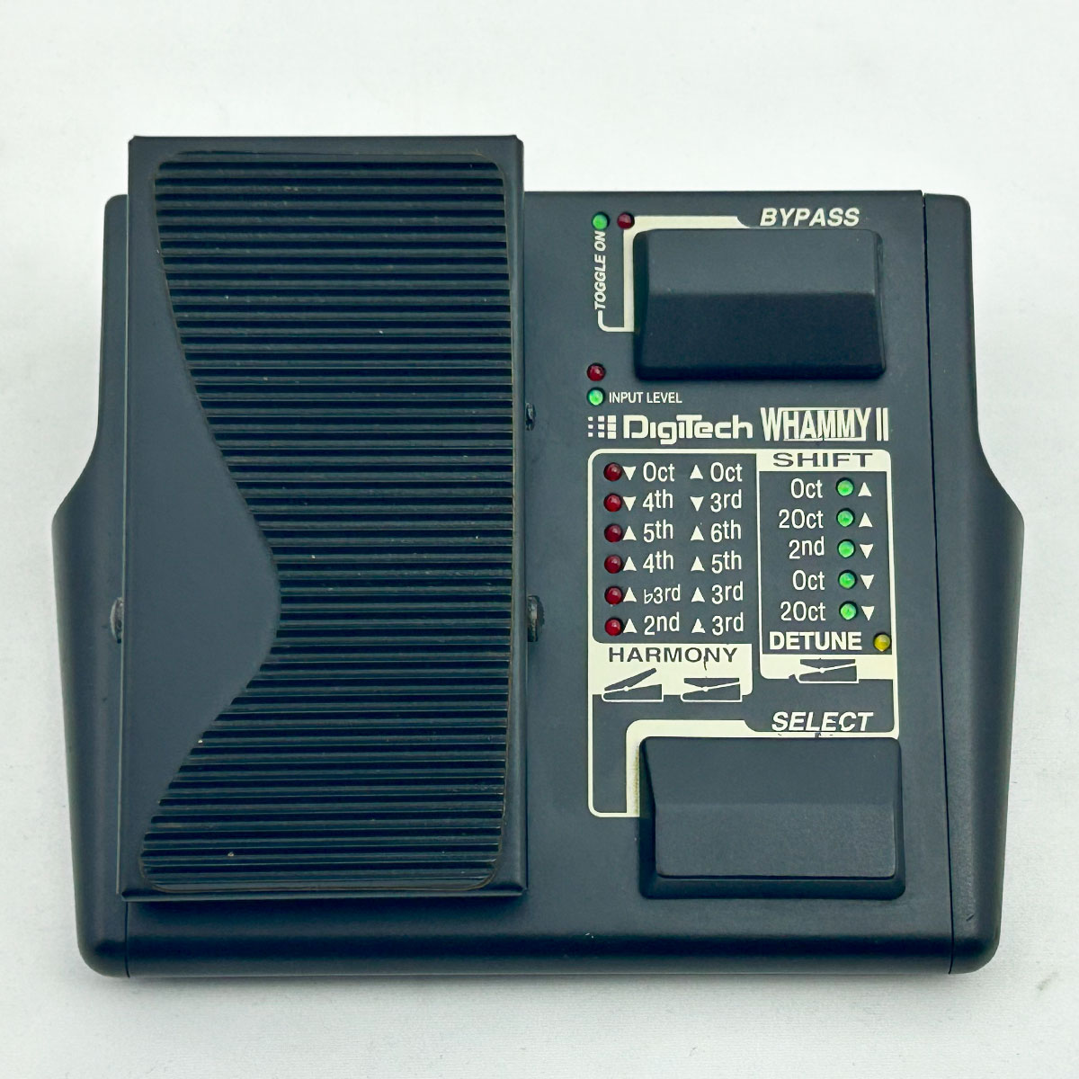 Top-down photo of a Digitech Whammy II guitar effects pedal showing the expression pedal, two footswitches, and the mode indicator panel.