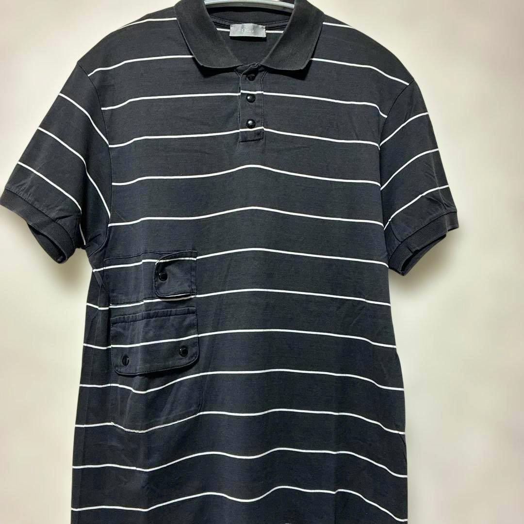 Front view of a black-striped Dior Homme cotton T-shirt with a polo collar, three-button placket, and lower-left flap pockets.