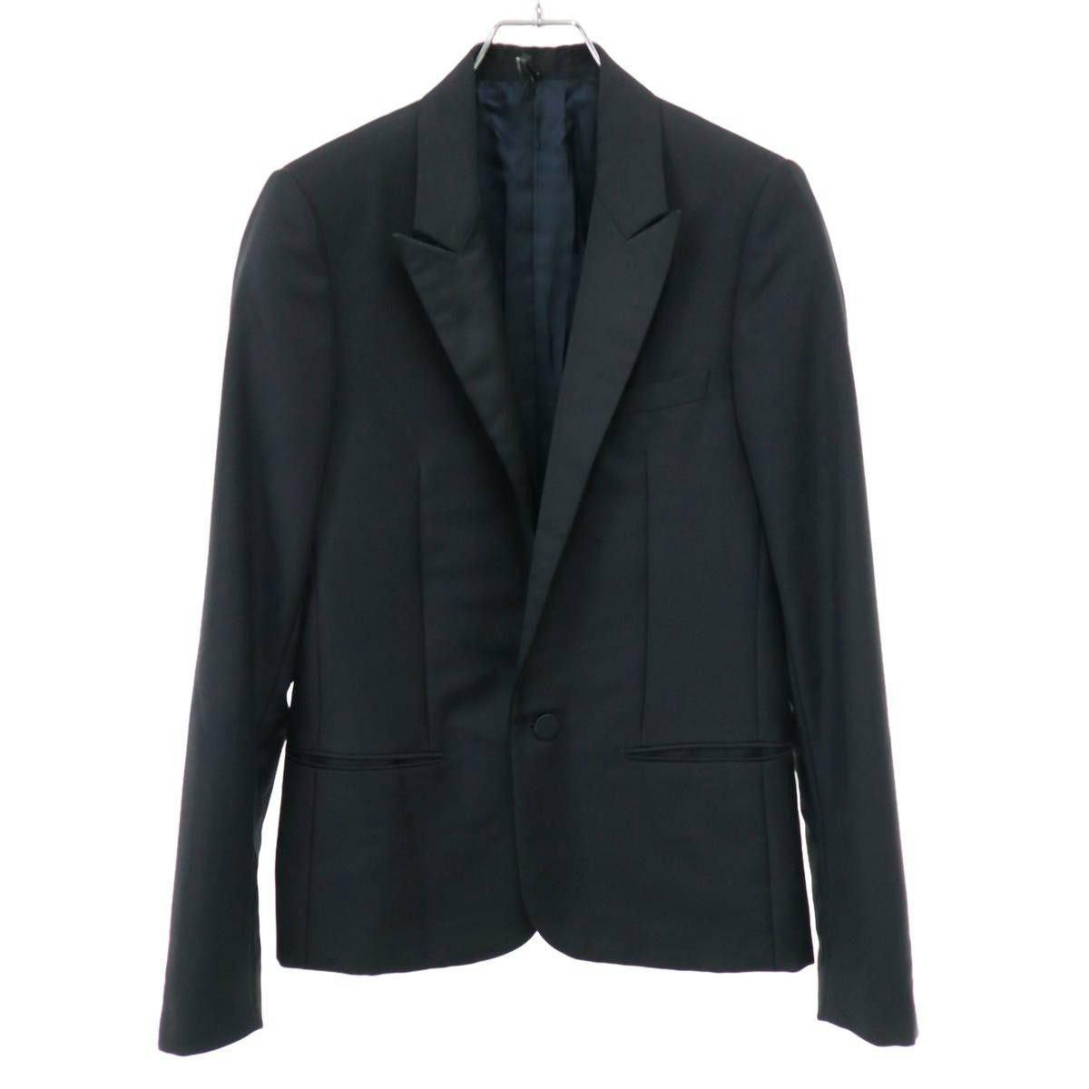 Front view of the black Dior Homme men's wool smoking tube jacket hanging on a hanger.