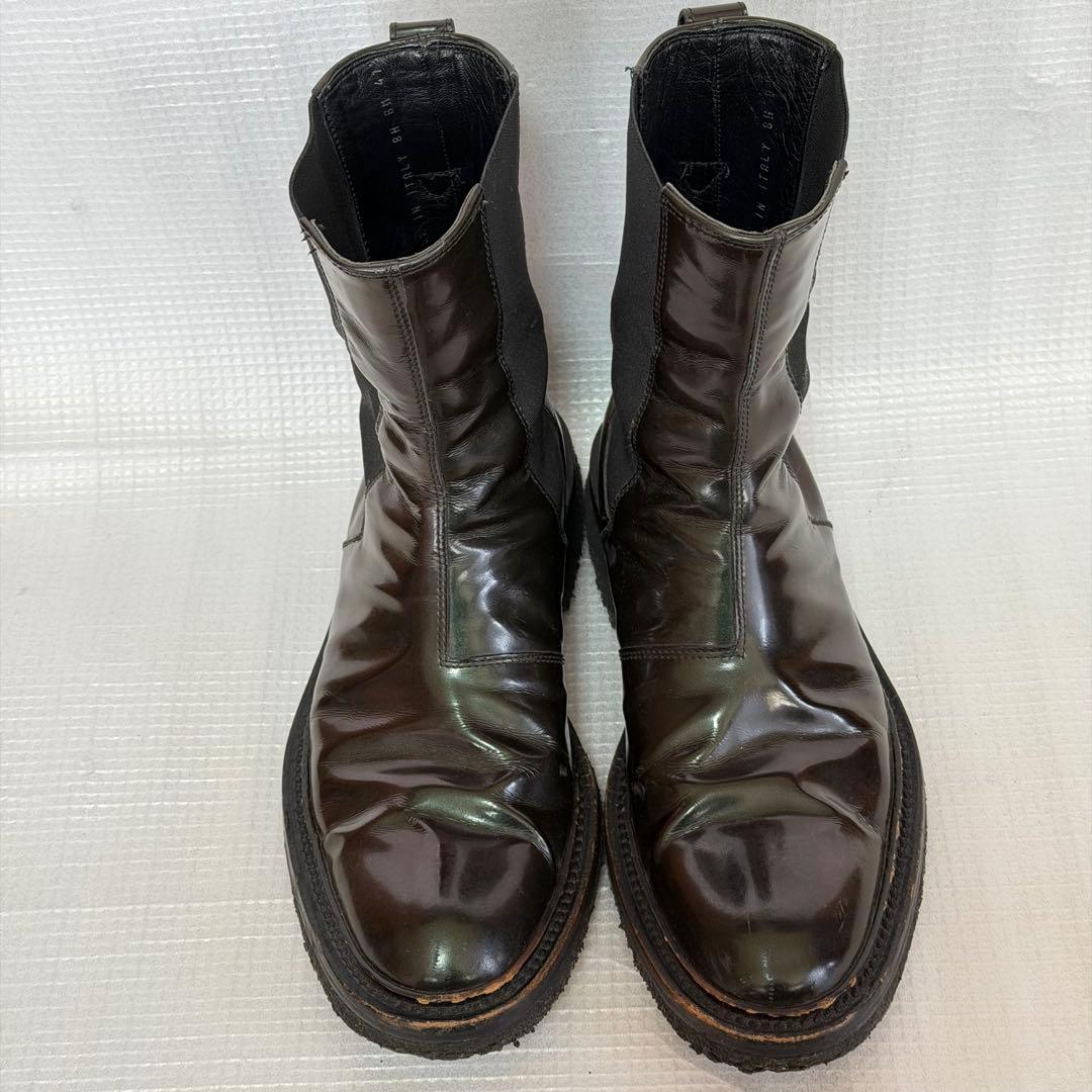 Top-down photo of Dior Homme patent leather side-gore boots (size 41.5) showing both boots on a light surface.