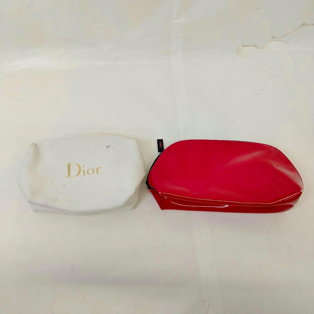 A white pouch labeled "Dior" and a red pouch displayed side by side on a white background.