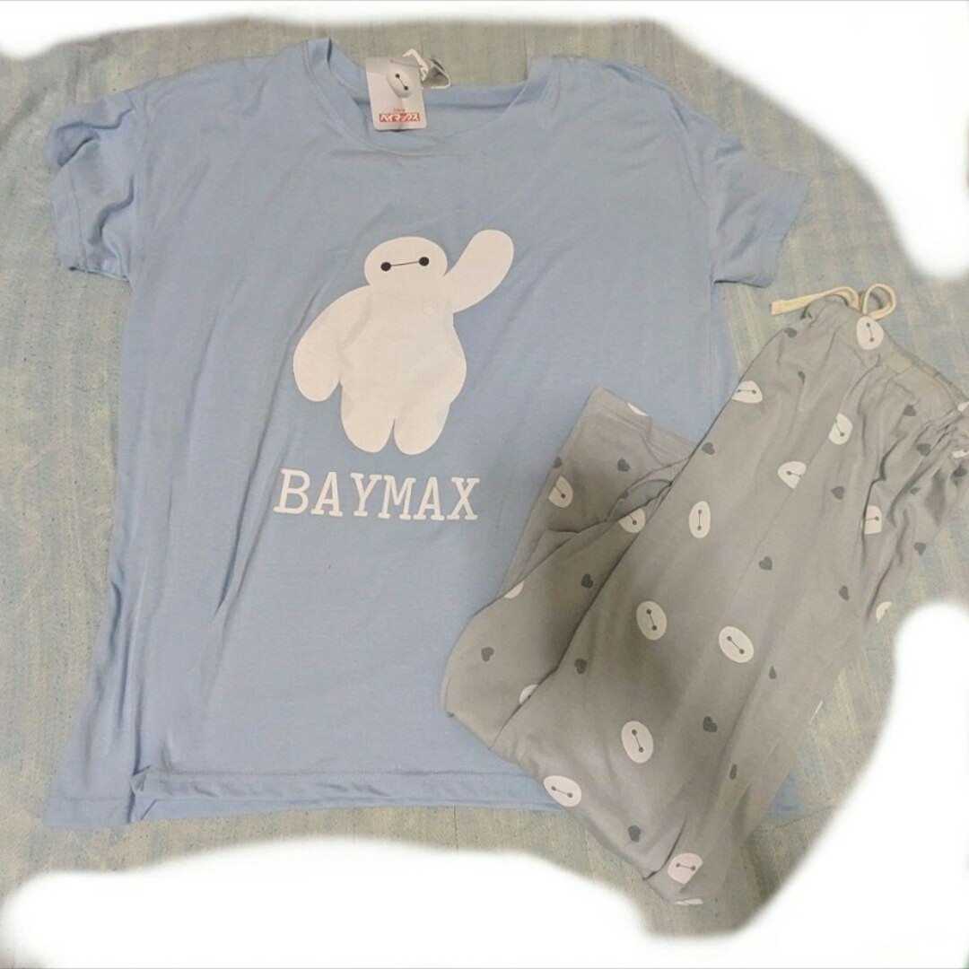 Light blue women's Baymax T-shirt with 'BAYMAX' text and matching grey pajama pants laid flat.