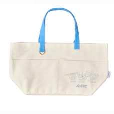 Front view of a large cream reusable tote bag with blue handles and a small printed design at the lower right.