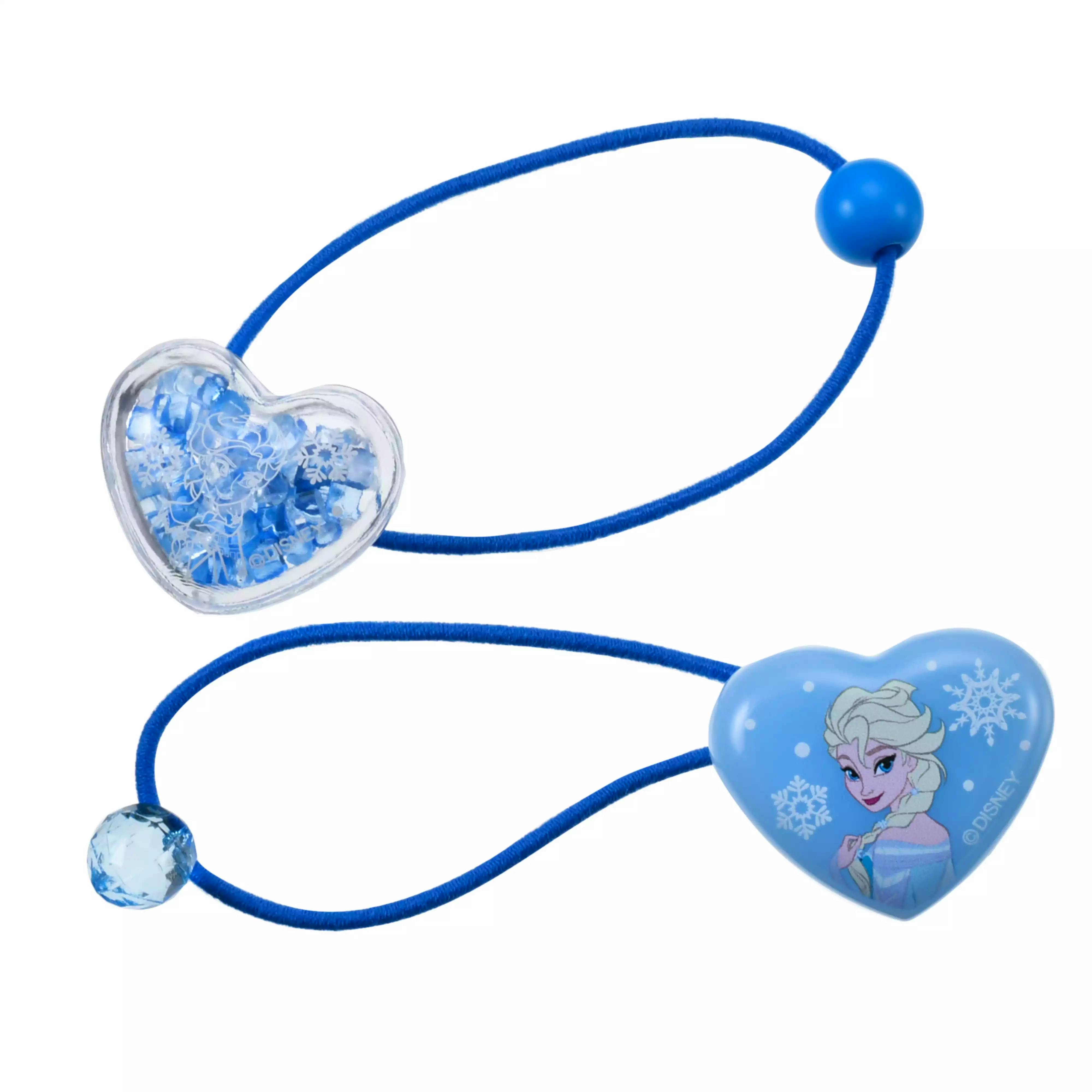 Close-up of blue children's hair bands with heart-shaped Elsa decorations on a white background.