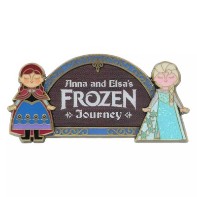 A pin badge showing stylized Anna and Elsa on either side of a sign that reads "Anna and Elsa's FROZEN Journey".