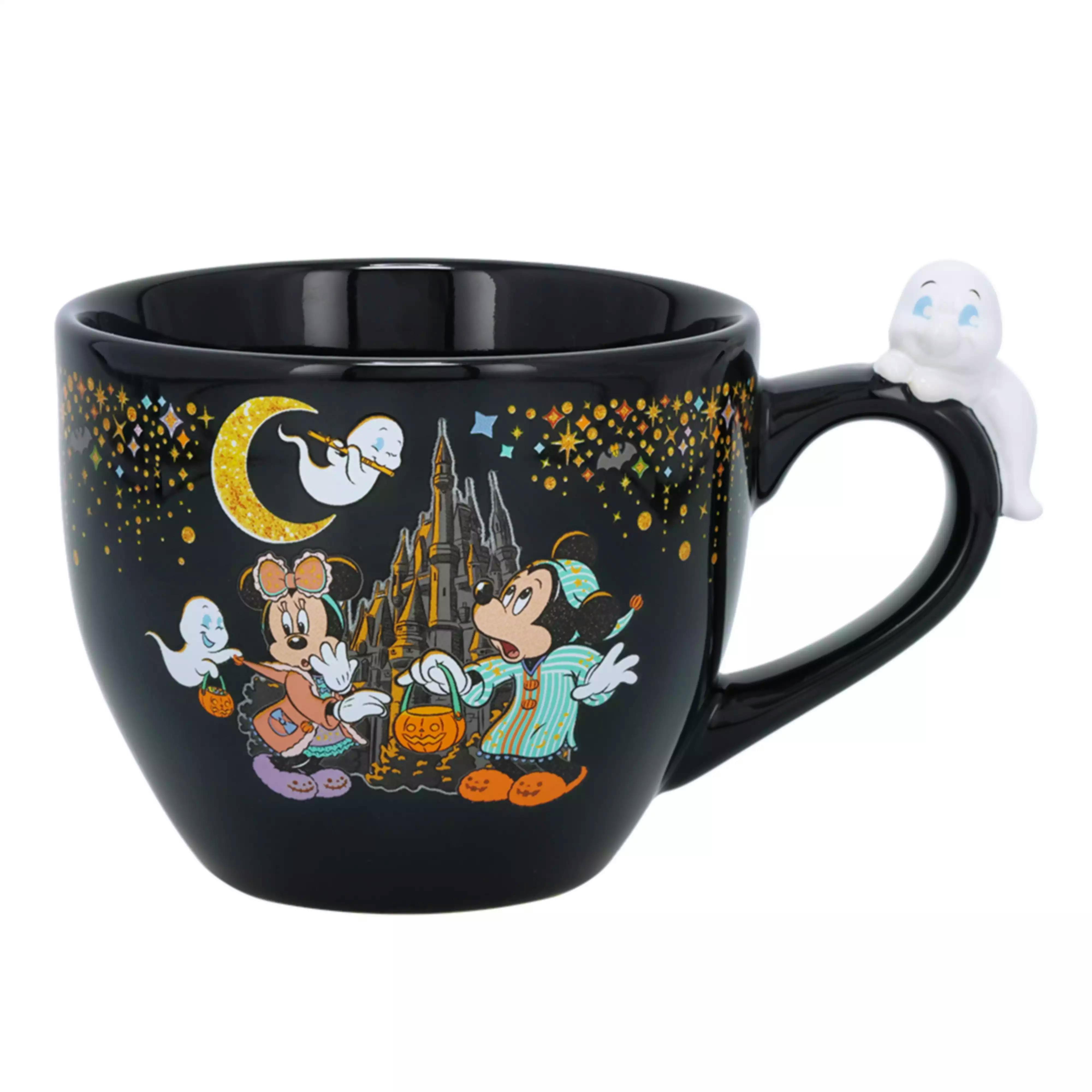 Close-up of a black ceramic Disney Halloween mug showing Mickey and Minnie with ghosts and a ghost-shaped handle.