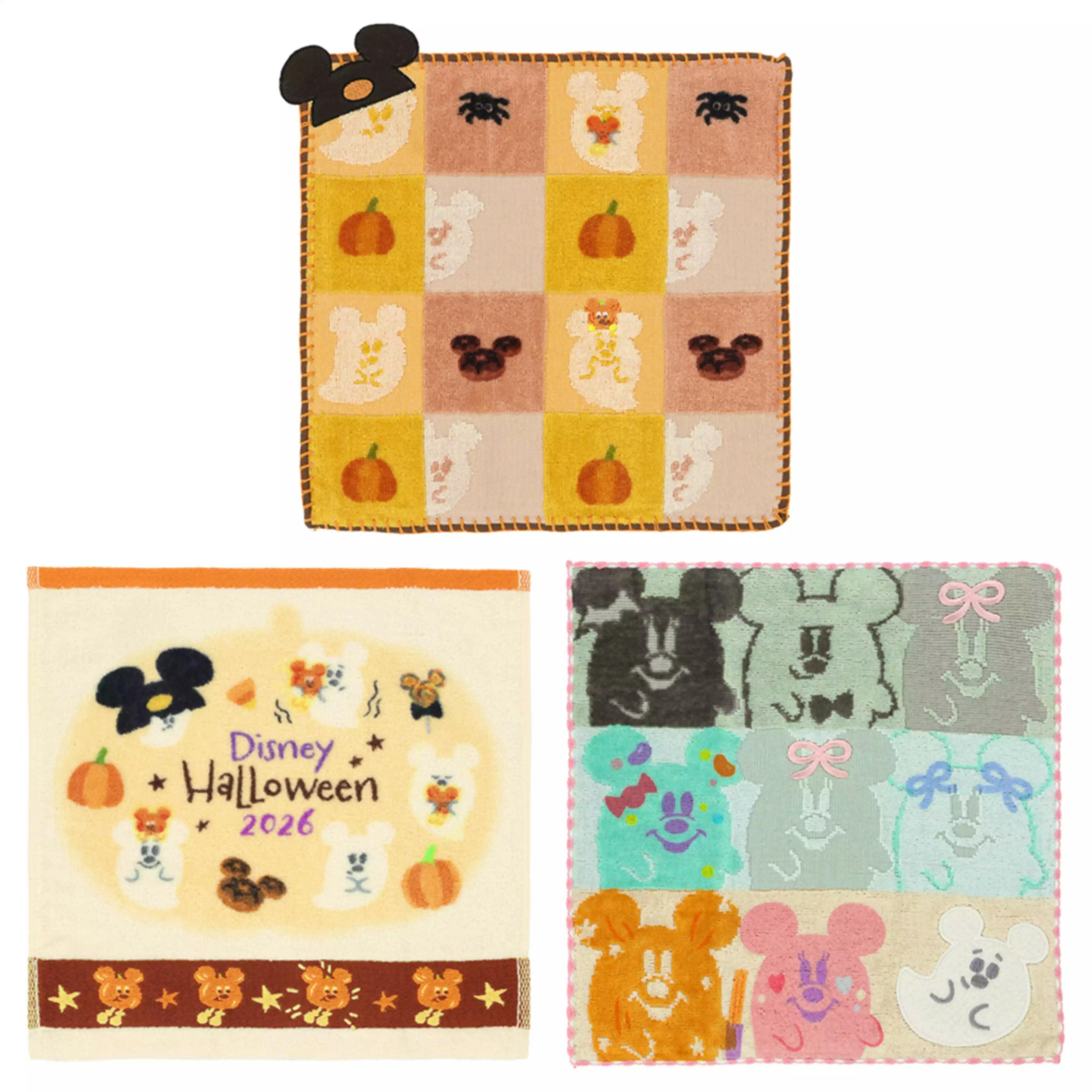A Halloween-themed mini towel with a checker pattern showing pumpkins, ghosts, spiders, and Mickey-shaped silhouettes.