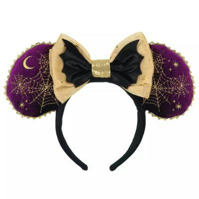 Black Minnie-style headband with purple ears decorated with gold spiderwebs and a crescent moon and a gold-and-black bow.