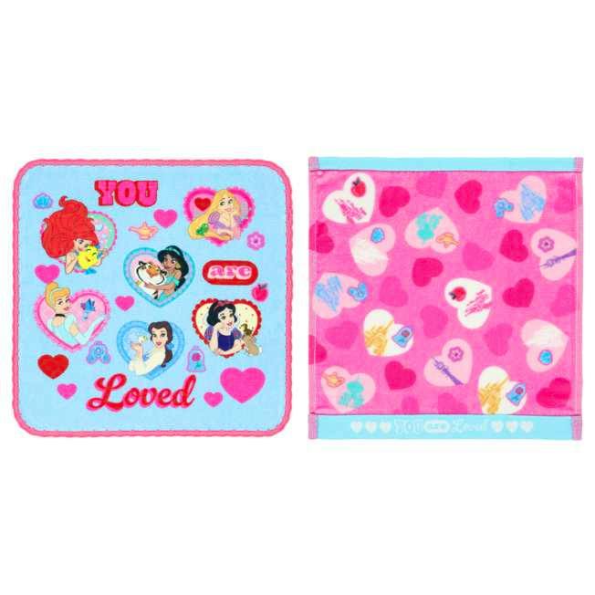 Two sides of a mini cotton handkerchief showing Disney Princess illustrations on a blue side and pink heart-patterned reverse.