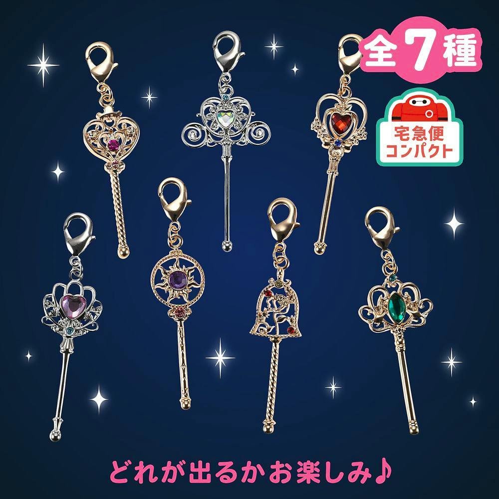 Seven Disney Princess stick-style bag charms with jeweled decorations displayed on a dark blue background with Japanese text and graphics.