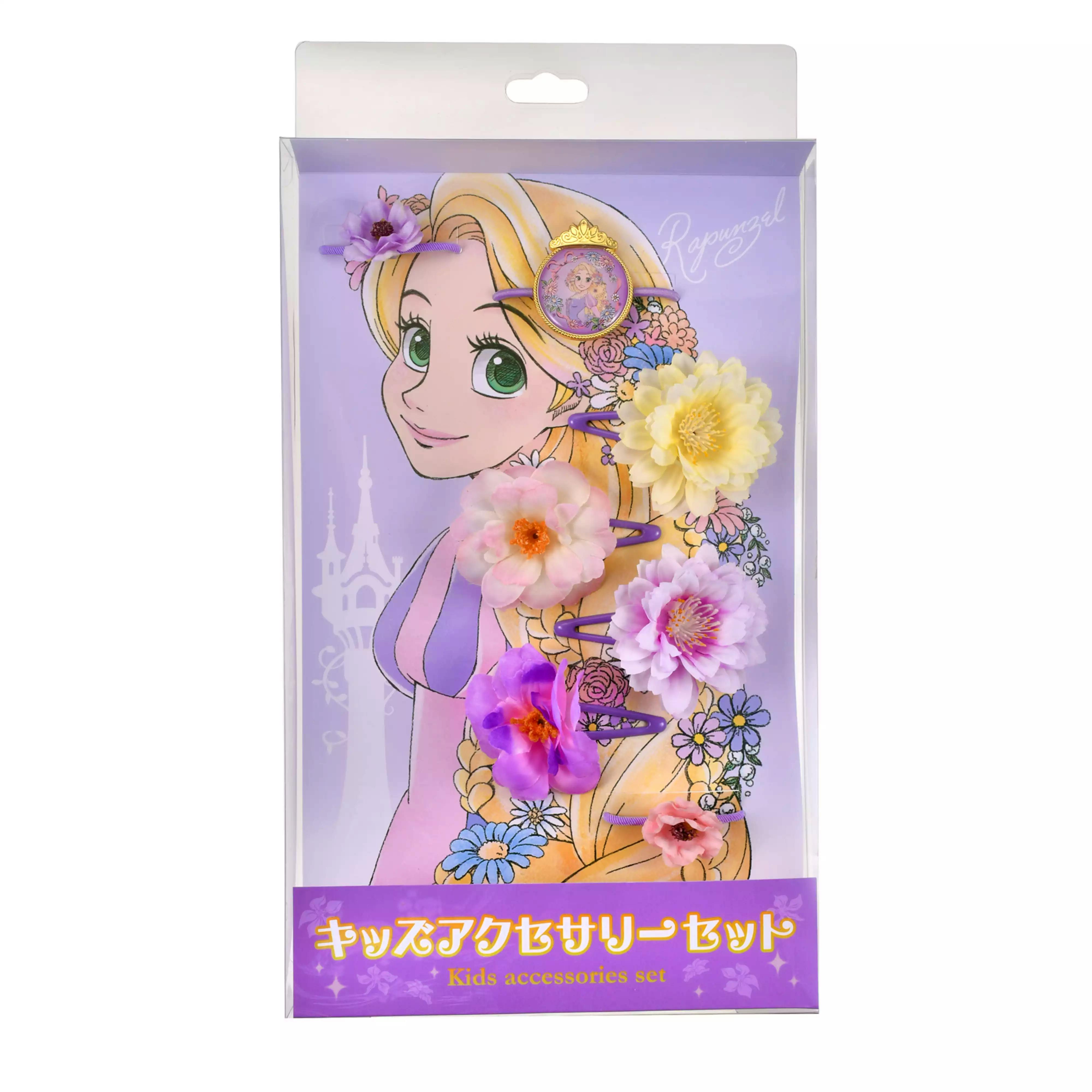 Packaged Rapunzel-themed kids hair clip set showing several floral hair clips on a purple illustrated backing.