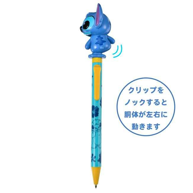Blue Stitch-themed ballpoint pen with a movable Stitch topper, yellow clip and tip, and a decorated blue barrel.